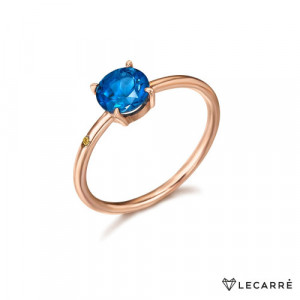 Anillo con topacio London Blue y diamante lateral. Oro rosa. LeCarré